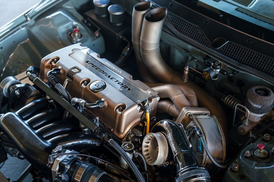 Detailed close-up of a high-performance engine in a modified car, showcasing engineering excellence.